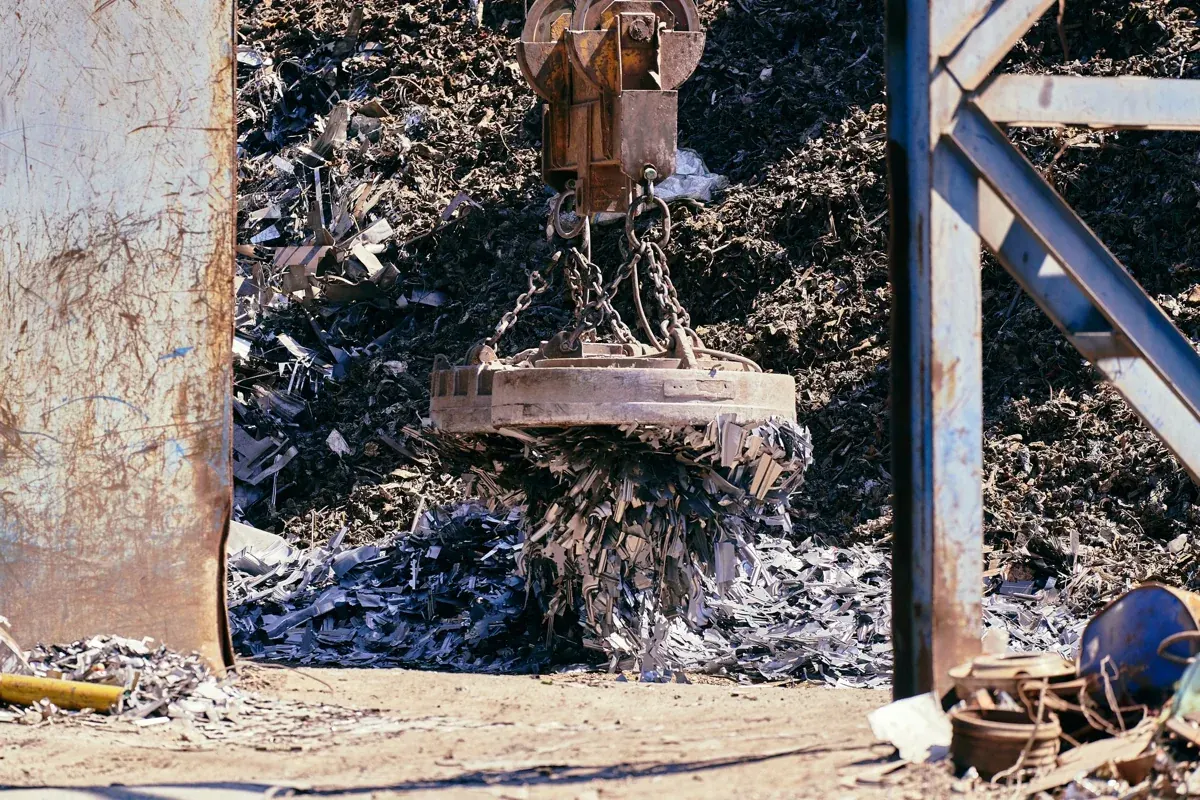 Industrial magnet recovering scrap metal for recycling